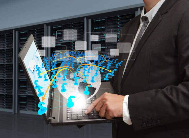 business man holds laptop computer and social network in server